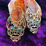 Load image into Gallery viewer, Brass Sugar Skull Hoops with Gemstone Eyes
